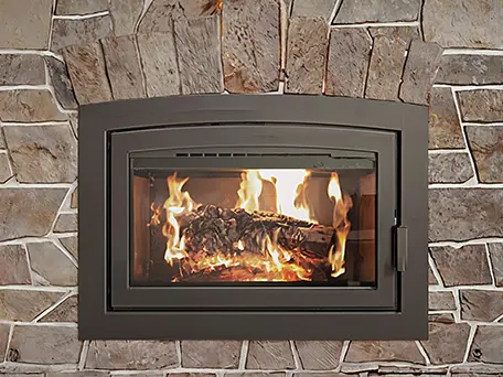 Modern wood-burning fireplace with arched top, nestled in a stone surround.