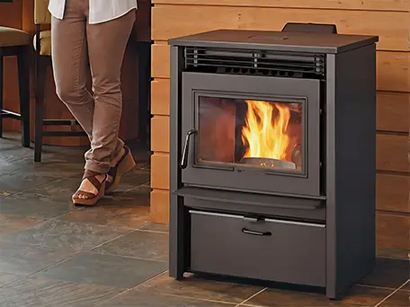 Modern pellet stove with a burning fire, showcasing efficient heating.