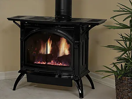 Black cast iron gas stove with realistic flame effect