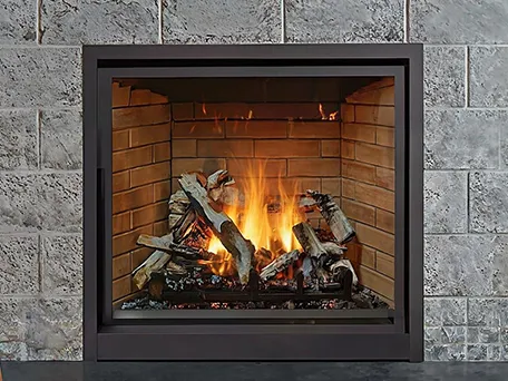 Modern gas fireplace with realistic log set and dark frame