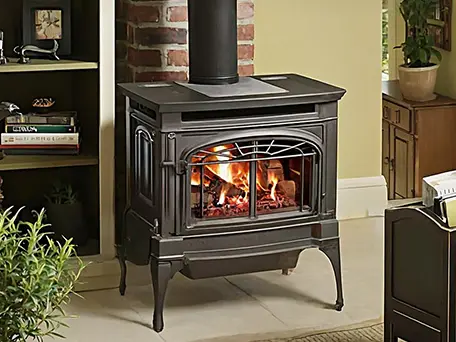Elegant black gas stove with realistic flame display.