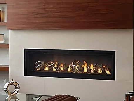 Modern linear gas fireplace with decorative metal orbs