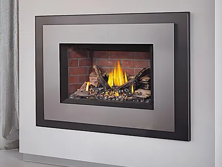 Modern gas fireplace with brick interior and brushed nickel surround.