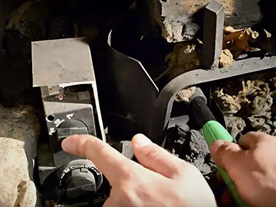 Lighting pilot on vented gas logs